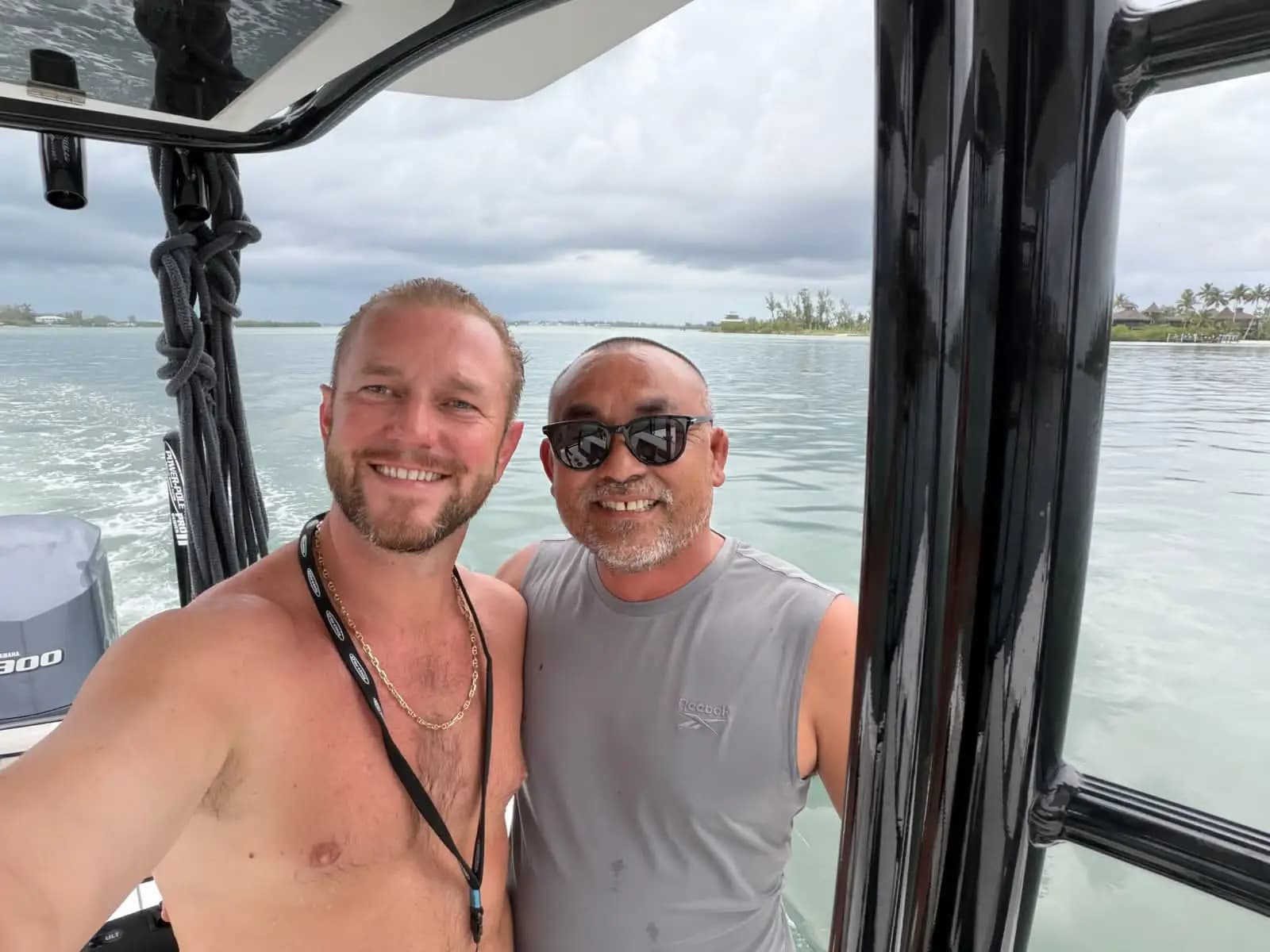 Two people aboard a boat on the water